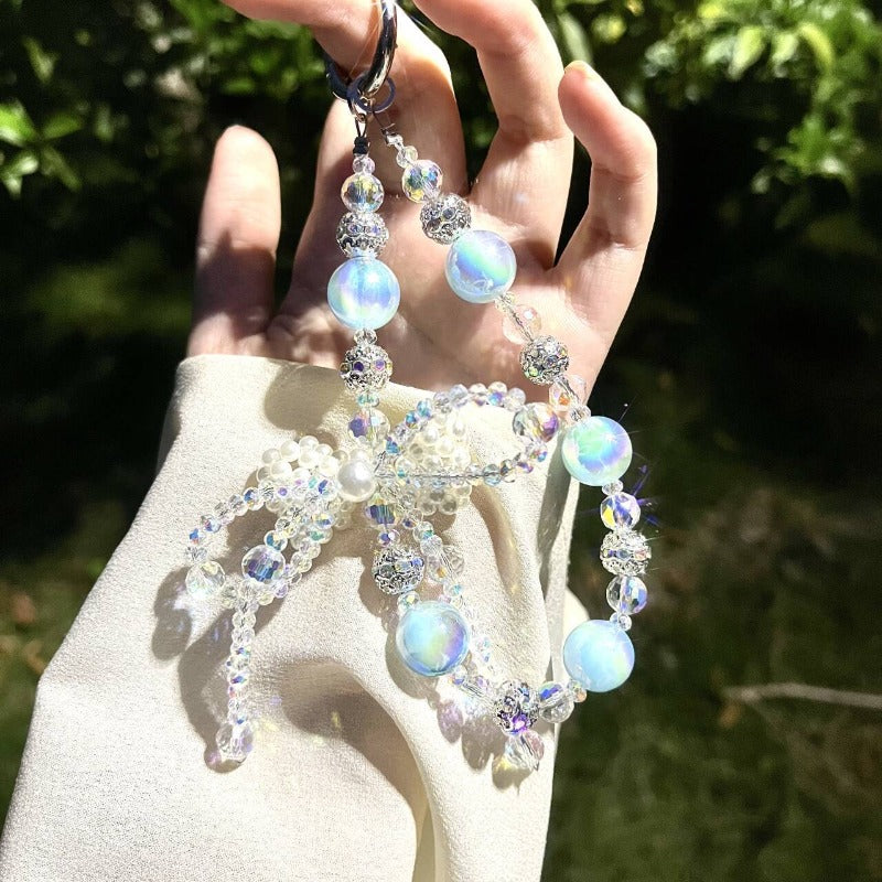 Designer Pearl Phone Strap with Lucky Bow & Rhinestone Chain – Cute Elegant Wrist Lanyard for Phones, AirPods & Keychains